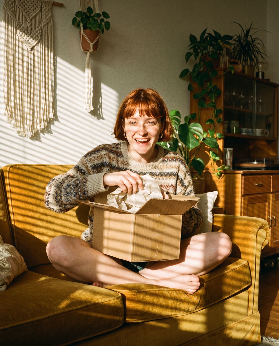 Brand-owned AI influencer unboxing a product at home